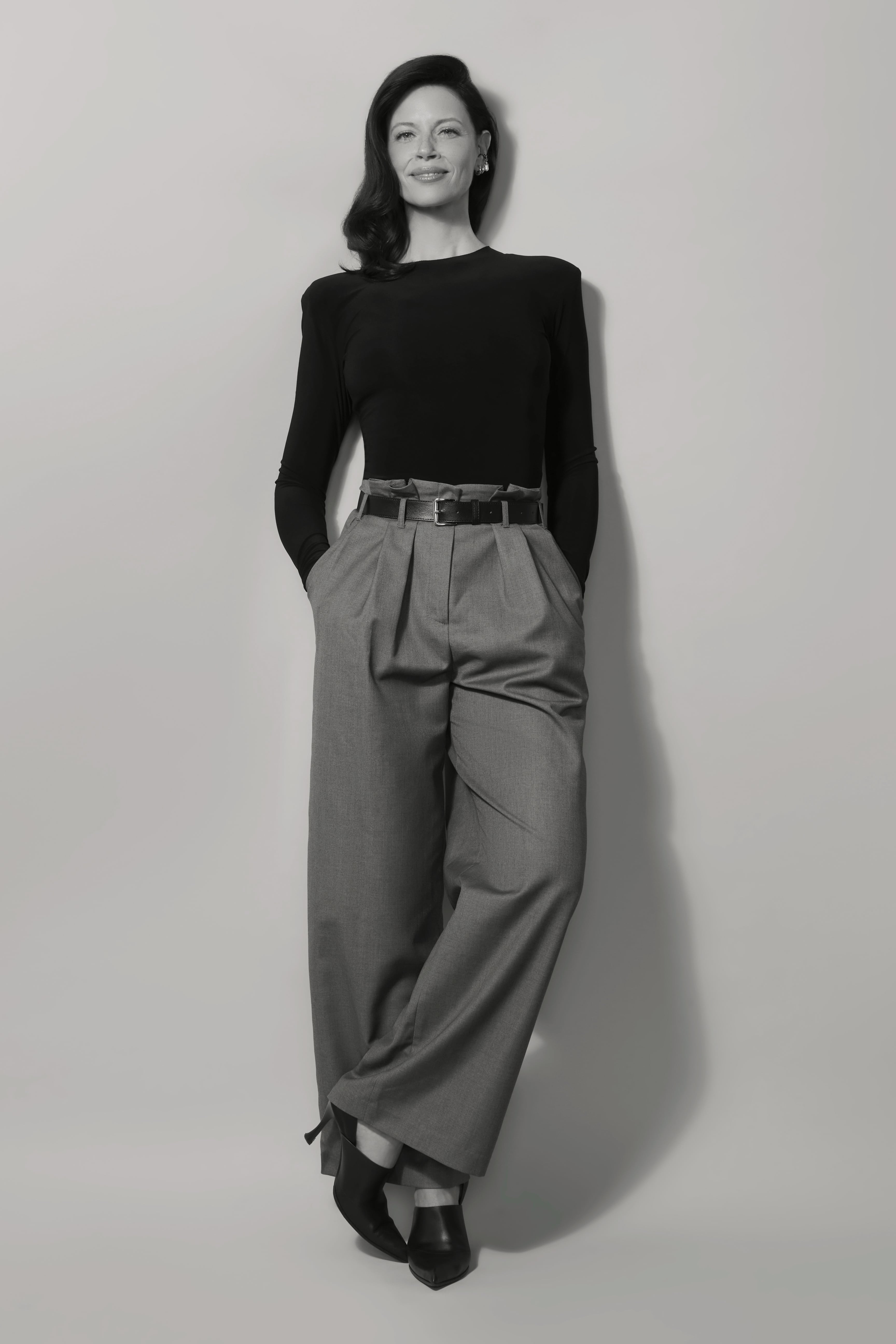 Hani Avital, standing confidently against a wall